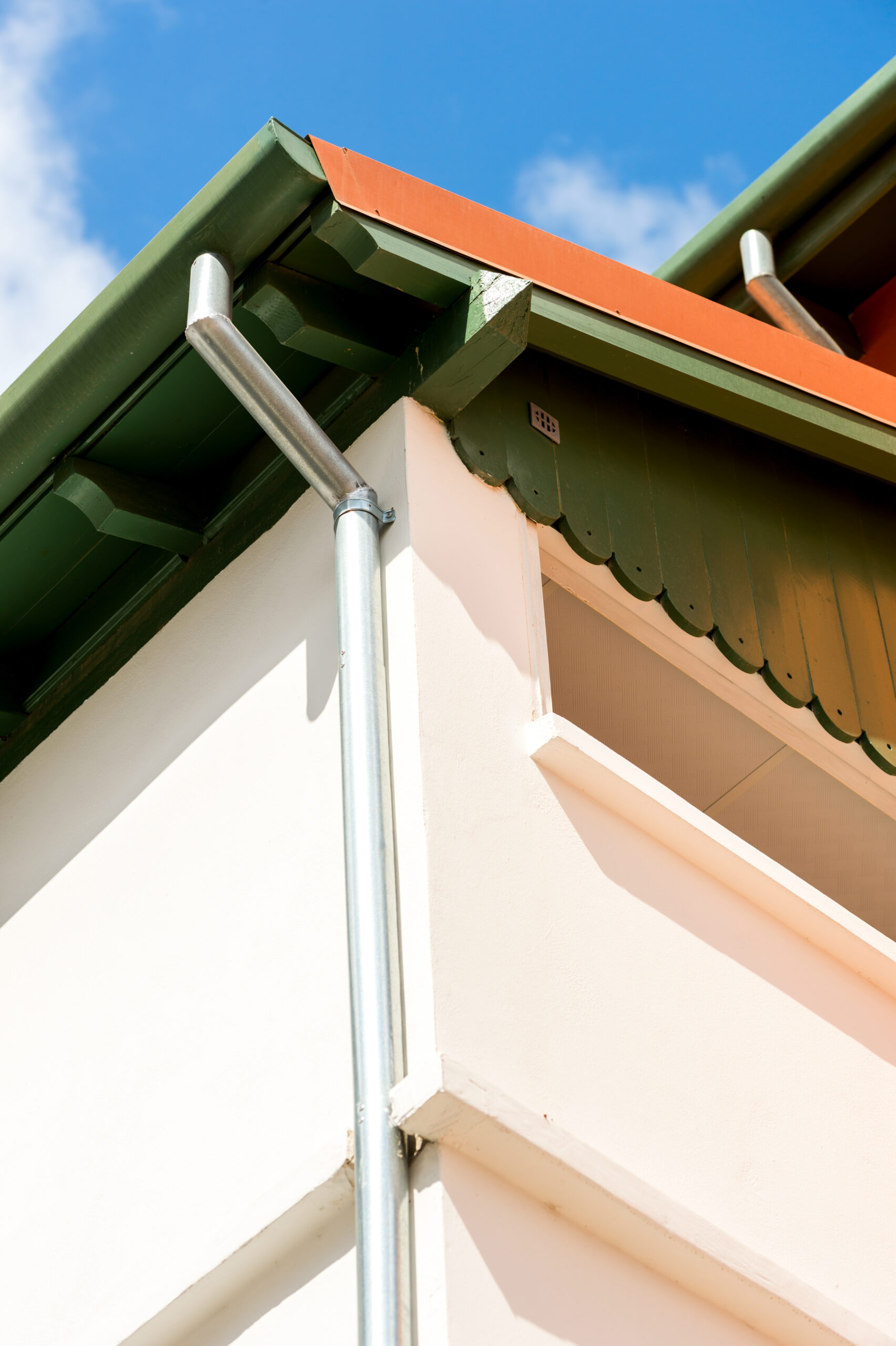 corner of the house with a drain pipe